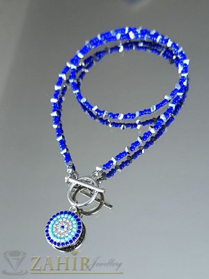  Елегантно ръчно изработено колие тип чокър с ефектна закопчалка и висулка синьо око 2 см, със стъклени мъниста с цвят електриково синьо и сребристи триъгълни мъниста, дълго 45 см - N1627